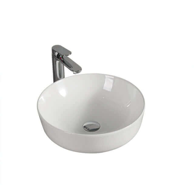 Lavabo rond blanc en porcelaine avec robinet chromé moderne. Design minimaliste et élégant pour salle de bain contemporaine. Surface lisse et brillante, résistante aux taches et rayures. Installation facile et entretien aisé. Salles de bain,Nouveautés,Tous produits