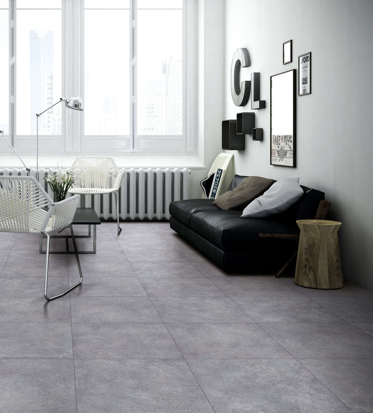 Modern living room with Céramique Stone Cement Grey tiles on floor, featuring contemporary furniture and decor - Entrepôt de la Réno.