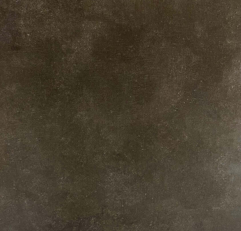 Carreau en céramique gris foncé au fini mat, offrant une texture subtile et une belle profondeur, idéal pour des applications murales ou au sol dans des espaces résidentiels ou commerciaux légers au style moderne.